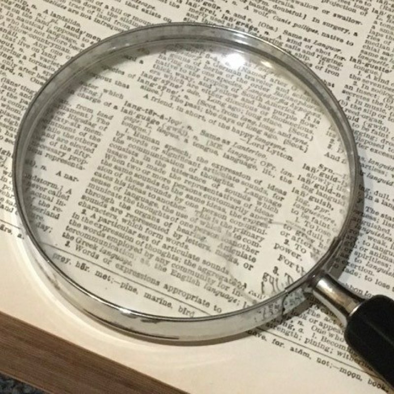 magnifying glass on the page of a book